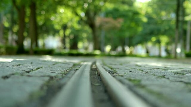 Focus pulling over a tram rail way.