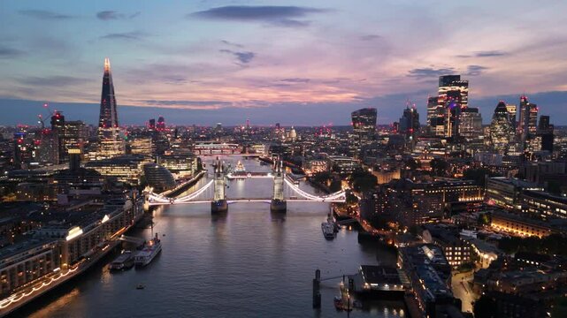 London aerial cityscape twilight view with illuminated Tower Bridge over Thames