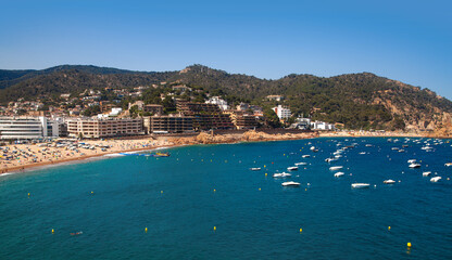 Fototapeta premium View of Tossa de Mar, Spain. Sandy beach drenched in sun.