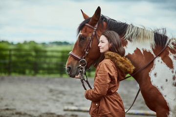 Obraz premium Ranch, walking and woman with horse on farm for bonding with pet in sustainable environment. Smile, nature and female person with equestrian animal for training in outdoor field by countryside.