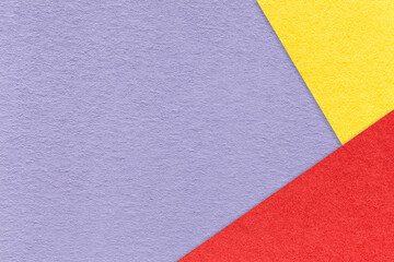 Fototapeta premium Texture craft light violet paper background with red and yellow border. Vintage abstract purple cardboard.