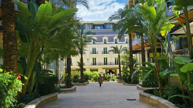 Shopping street in Monte Carlo, Monaco with a woman walking around