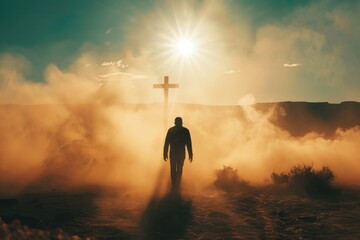 Silhouette of a man in the desert with a cross in the smoke and dust under the sun