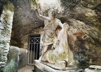 Rappresentative statue of God Mithras killing a bull in the thermal s mithraeum of archaeological excavation of Ostia Antica in Rome