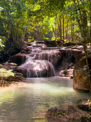 Fototapeta premium Waterfall on a river in the tropical forest of Thailand
