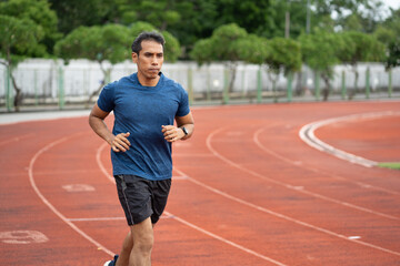  Mature fitness Asia man running on racetrack