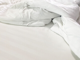 Top view of the crease of an unmade bed sheet in the bedroom after a long night sleep and waking up in the morning