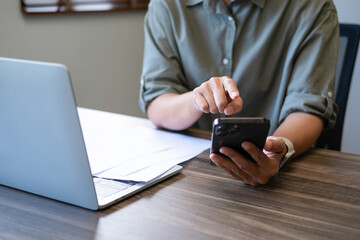 Businesswomen drive online store success together.