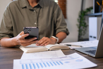 Businesswomen drive online store success together.