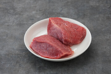 Fresh raw beef (daging sapi), food preparation.
