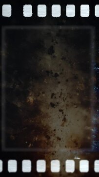 Closeup of Vertical film strip on brown background with doodle grunge lines. Dust and scratches. High quality 4k footage