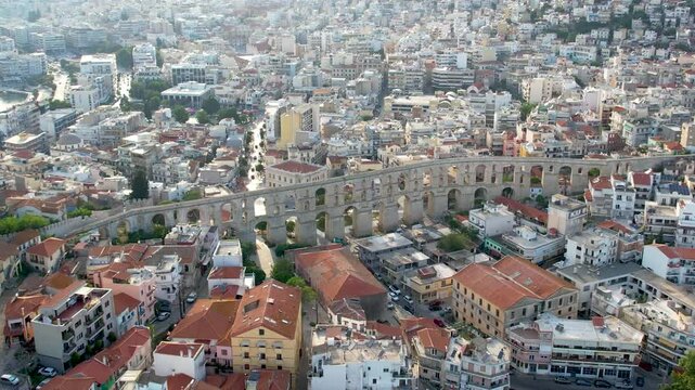Aerial Point of Interest Shot of Kavala Greece City Center and Kamares Aqueduct Panorama View