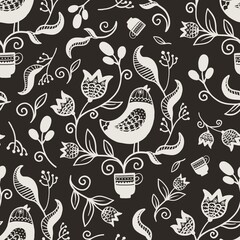 Ukrainian traditional ethnic national pattern, in which the central place is occupied by a bird surrounded by flowers. Bird with plant, flowers in cup with ethnic elements, black and white