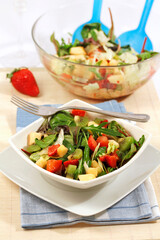 Green salad with fruits.