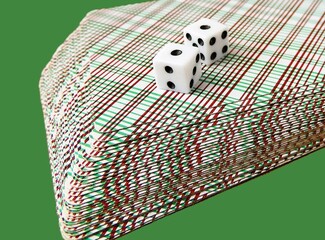 Playing cards and dice on a green background