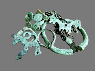 Antique bronze jewelry on a gray isolated background