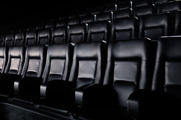 Obraz premium Close-up of stylish leather seats in the cinema. Cinema hall before the start of the session