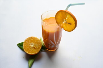 Fresh Orange juice on white background. It is a famous fruit juice which contains lots of vitamins like vitamin C, folate and potassium. Healthy drink. Fruit juice.
