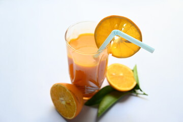 Fresh Orange juice on white background. It is a famous fruit juice which contains lots of vitamins like vitamin C, folate and potassium. Healthy drink. Fruit juice.
