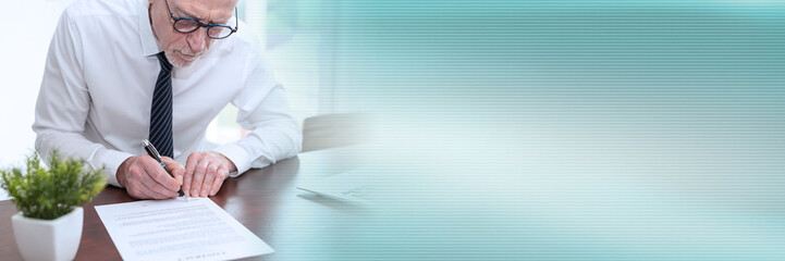 Senior businessman signing a document (lorem ipsum text used); panoramic banner