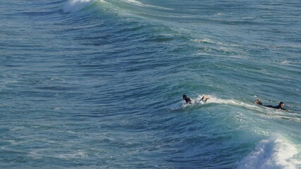 Naklejka premium Surfing / Riding waves at Banana Beach Agadir Morocco