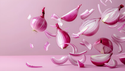 Whole and cut fresh red onions falling on light violet background