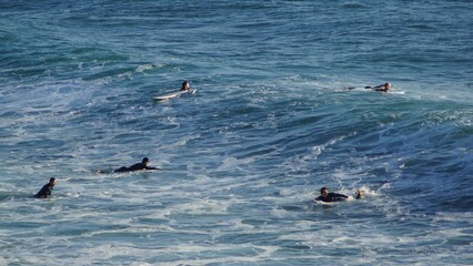Fototapeta premium Surfing / Riding waves at Banana Beach Agadir Morocco