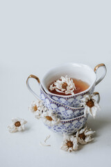vintage porcelain cups and chamomile tea