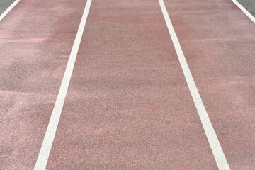 Fototapeta premium Detail of the running track on a school sports field