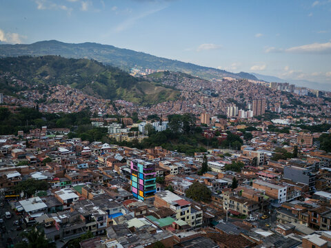 Aerial view of colorful buildings and mountains in Comuna 13, Medellin, Colombia.