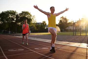 Obraz premium Portrait of a winning athlete in a race at the stadium