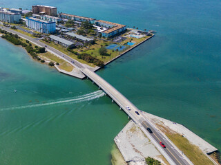 Dunedin, United States - 15 April 2024: Aerial view of coastal residential area with bridge and island, Dunedin, Florida, United States.