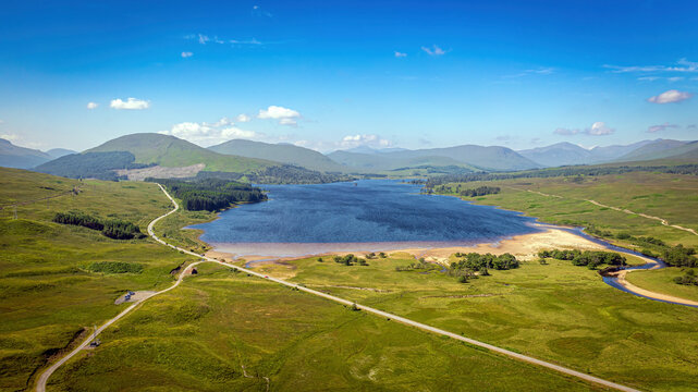 Aerial view of Loch Tulla surrounded by mountains and hills, Bridge of Orchy, Scotland.