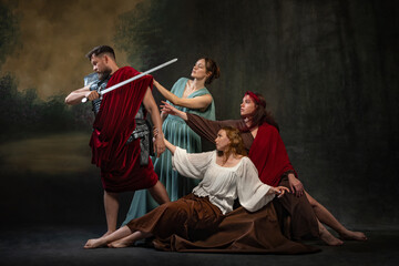 Man in medieval armor and red cloak brandishes sword while three women, dressed in flowing garments, reach out to him. Historical narrative. Concept of heroism, individual valor and collective support