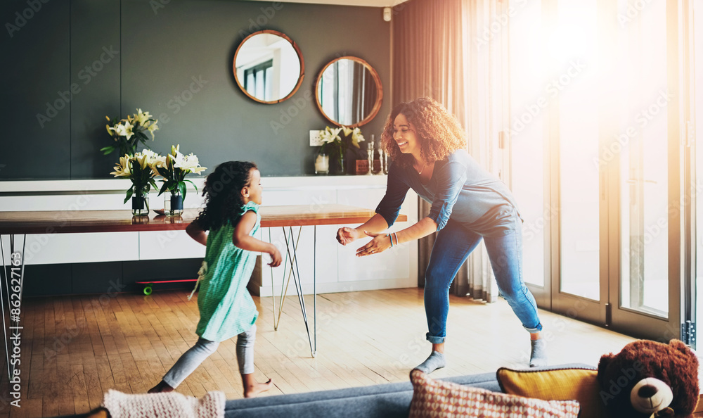 Poster Love, girl and running to mom in living room with child for playing, fun activity or family. Lens flare, happy parent and kid daughter with care for support, relationship or bonding together in home