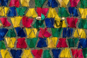 Aerial view of vibrant straw mats drying in An Cu, Phu Yen, Vietnam.