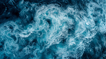 Obraz premium A large body of water with a lot of white foam and bubbles. The water appears to be very choppy and rough, with waves crashing against the shore. Scene is one of turbulence and energy