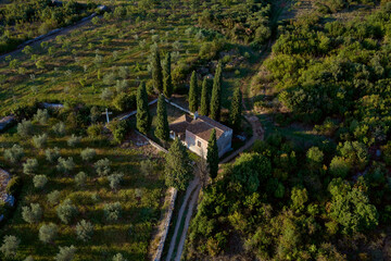 Aerial view of Old Church surrounded by fields, forests, and trees in Vodnjan, Istria, Croatia.