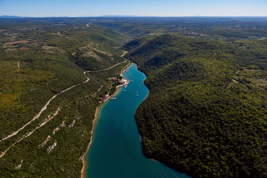 Aerial view of Lim Canal, river, forest, mountains, and road, Istria, Croatia.