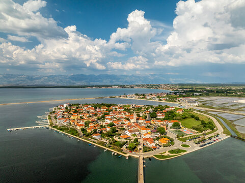 Aerial view of picturesque town Nin with coastal buildings and water, Zadar County, Croatia.