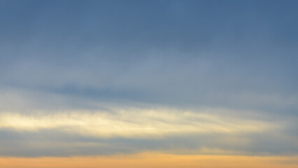 Fototapeta premium The yellow and blue color gradient on an overcast sky