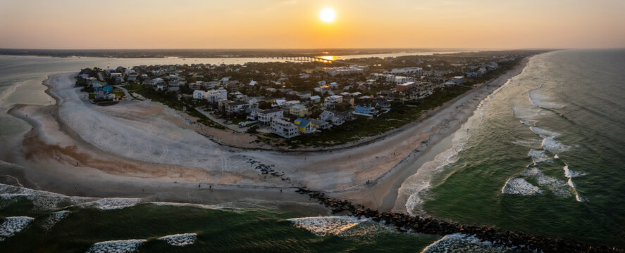 Aerial view of serene sunset over Vilano Beach shoreline, St. Augustine, Florida, United States.