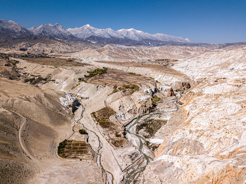 Aerial view of remote, rugged canyon in Lo Manthang, Nepal.