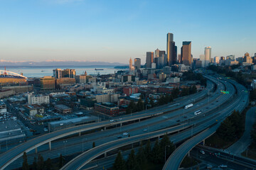 Aerial view of downtown Seattle skyline with highways, buildings, and water, Interstate 5 & 90 Interchange, Seattle, Washington, United States.