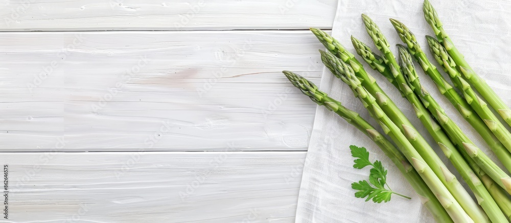 Aufkleber scandinavian-inspired top-down view mockup featuring fresh green asparagus on a white wooden table, 