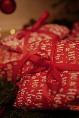 christmas and new year holidays. magical atmosphere. packaging and ribbons for gifts. beautiful boxes and things are packed under the Christmas tree.