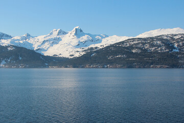 the reflections of snow covered mountains in Alaska