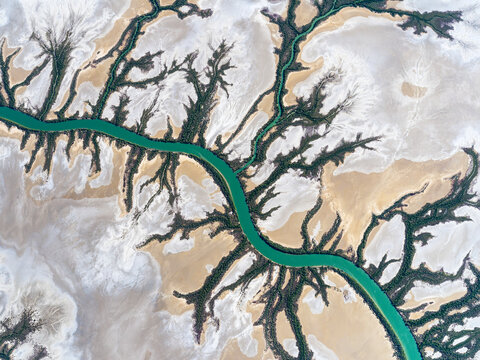 Aerial view of meandering river through flood plain and wetlands, Gulf of Carpentaria, Queensland, Australia.