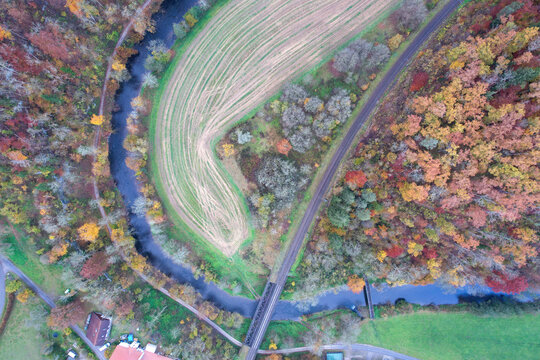 Aerial view of colorful Autumn Bridge over River in forest, Rottweil, Baden-Wurttemberg, Germany.