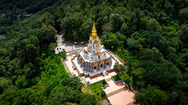 Aerial view of temple nestled in forested mountain, Mae Salong Nok, Thailand.